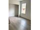 Bedroom with light gray walls, modern flooring and a new window at 629 W 9Th, Lakeland, FL 33805