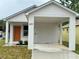 Charming single-Gathering home with a covered carport and a brightly colored front door at 629 W 9Th, Lakeland, FL 33805