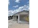 New single story home with a carport and gray trim at 629 W 9Th, Lakeland, FL 33805
