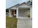 Charming single-Gathering home with a covered carport and a brightly colored front door at 629 W 9Th, Lakeland, FL 33805