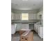 Bright, spacious kitchen with recessed lighting, modern cabinets and countertops, and new flooring at 629 W 9Th, Lakeland, FL 33805