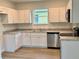 Modern kitchen featuring white cabinets, stainless steel appliances, and ample counter space at 629 W 9Th, Lakeland, FL 33805