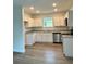 Modern kitchen featuring white cabinets, stainless steel appliances, and ample counter space at 629 W 9Th, Lakeland, FL 33805