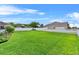 A lush green lawn fills the fenced backyard, offering plenty of space for recreation and gardening at 647 Hart Lake Dr, Winter Haven, FL 33884