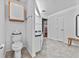 Bathroom with a toilet and sink vanity shows access to the rest of the house at 647 Hart Lake Dr, Winter Haven, FL 33884