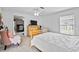 Bright bedroom featuring tiled floors, a ceiling fan, and a view to the connected office space at 647 Hart Lake Dr, Winter Haven, FL 33884