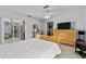 Airy bedroom with tiled floors, access to an outdoor patio, and ample natural light at 647 Hart Lake Dr, Winter Haven, FL 33884