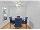 Cozy dining area with a ceiling fan and natural light from a window at 647 Hart Lake Dr, Winter Haven, FL 33884