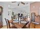 Dining room with wood floors that opens into the living room at 647 Hart Lake Dr, Winter Haven, FL 33884
