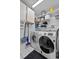 Functional laundry room with washer, dryer, and ample storage space at 647 Hart Lake Dr, Winter Haven, FL 33884