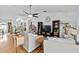 Cozy living room with hardwood floors, ceiling fan, and comfortable seating at 647 Hart Lake Dr, Winter Haven, FL 33884