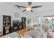 Stylish living room with modern decor, hardwood floors, and lots of natural light at 647 Hart Lake Dr, Winter Haven, FL 33884