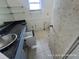 Damaged bathroom with vanity, sink, and cabinets at 6610 Chippendale Rd, Lakeland, FL 33809
