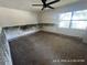 Full view of the bedroom, highlighting the full carpet flooring, walls, and window at 6610 Chippendale Rd, Lakeland, FL 33809