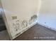 Showing a side of a bedroom, revealing walls, floor trim, and some electrical outlets at 6610 Chippendale Rd, Lakeland, FL 33809