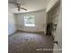 Bedroom showcasing a standard window, fan, and closet at 6610 Chippendale Rd, Lakeland, FL 33809
