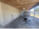 Enclosed carport with access door at 6610 Chippendale Rd, Lakeland, FL 33809