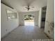 The dining room features a ceiling fan, tiled floor, and sliding glass doors leading to the outside at 6610 Chippendale Rd, Lakeland, FL 33809
