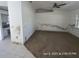 Living room with carpet, an adjoined kitchen, and wall damage from moisture at 6610 Chippendale Rd, Lakeland, FL 33809