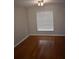 Bedroom with wood floors, a window with blinds and neutral paint at 676 Jessanda Cir, Lakeland, FL 33813