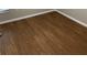 Rich wood laminate flooring with clean white baseboards at 676 Jessanda Cir, Lakeland, FL 33813