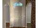 Inviting foyer with wood floors and arched doorways adding architectural interest to the home's design at 676 Jessanda Cir, Lakeland, FL 33813