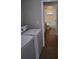 Laundry room with washer and dryer, leading to a full bathroom at 676 Jessanda Cir, Lakeland, FL 33813