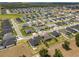 A beautiful aerial view shows the neighborhood and its neatly lined homes and green lawns at 6777 Bentridge Dr, Lakeland, FL 33813