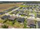 Picturesque aerial view of the home nestled in a well-maintained community with numerous nearby residences at 6777 Bentridge Dr, Lakeland, FL 33813