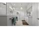 Modern bathroom with glass shower, dual sinks, marble tile, and elegant chandelier lighting at 6777 Bentridge Dr, Lakeland, FL 33813