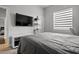 Cozy bedroom features neutral colors, a large window, and a modern interior design at 6777 Bentridge Dr, Lakeland, FL 33813