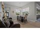 Open dining room with lots of sunlight, neutral tones, and modern decor at 6777 Bentridge Dr, Lakeland, FL 33813