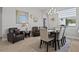 Dining room with modern decor, chandelier lighting, and lots of natural light at 6777 Bentridge Dr, Lakeland, FL 33813