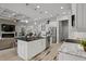 Kitchen island with modern appliances and stone countertops with white cabinets at 6777 Bentridge Dr, Lakeland, FL 33813