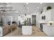 Open kitchen featuring a large island, stainless steel appliances, and bright lighting at 6777 Bentridge Dr, Lakeland, FL 33813
