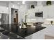 The kitchen features a large island with seating and modern appliances with white cabinets at 6777 Bentridge Dr, Lakeland, FL 33813