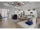 Spacious living room with coffered ceilings, modern furniture, and an open floor plan at 6777 Bentridge Dr, Lakeland, FL 33813