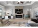 Cozy living room features a stone fireplace, coffered ceilings, and sleek decor at 6777 Bentridge Dr, Lakeland, FL 33813