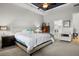 Main bedroom with a tray ceiling, carpet floors, and neutral tones at 6777 Bentridge Dr, Lakeland, FL 33813