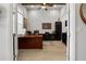 Well-lit home office featuring a large desk, built-in storage, and a ceiling fan at 6777 Bentridge Dr, Lakeland, FL 33813