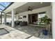 Covered patio with ceiling fans, outdoor seating, and easy access to the indoor living area at 6777 Bentridge Dr, Lakeland, FL 33813
