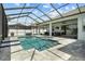 Spacious screened-in pool area, perfect for relaxation and outdoor gatherings at 6777 Bentridge Dr, Lakeland, FL 33813
