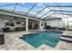 Screened pool with seating, barbecue, and fan-covered outdoor living area at 6777 Bentridge Dr, Lakeland, FL 33813