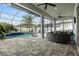 Inviting pool area with ample seating and shade, perfect for outdoor entertaining at 6777 Bentridge Dr, Lakeland, FL 33813