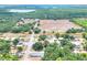 This home enjoys an appealing aerial view, revealing nearby businesses and convenient access to community features at 6949 2Nd St, Mulberry, FL 33860