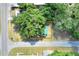Aerial view of quaint home nestled among mature trees, offering privacy and natural beauty near a quiet neighborhood at 6949 2Nd St, Mulberry, FL 33860