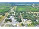 Bird's-eye view of the property, highlighting its proximity to local attractions and a serene lakeside setting at 6949 2Nd St, Mulberry, FL 33860