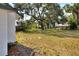 Large backyard featuring mature trees and ample space at 6949 2Nd St, Mulberry, FL 33860