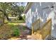 View of the backyard with new wood stairs and a white exterior at 6949 2Nd St, Mulberry, FL 33860