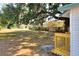 Large backyard with wood fence and big oak tree at 6949 2Nd St, Mulberry, FL 33860